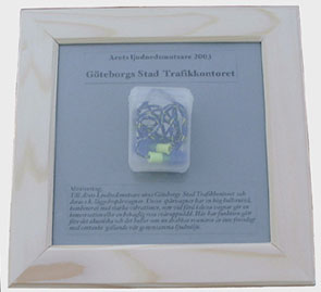 Receiver of "Sound Polluter" obtain a framed box of earplugs.